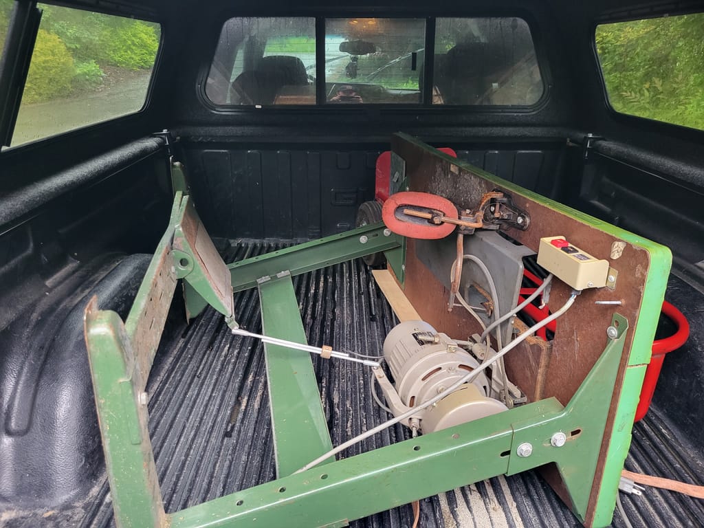 crusty industrial sewing machine table in back of truck